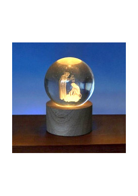 Boule sur socle en bois avec nativité gravée au laser et lumière LED